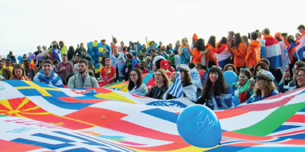 Students waiving multiple flags during an event