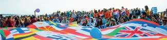 Students waiving multiple flags during an event